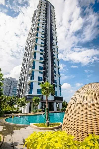 Exterior type: high-rise condominium; features: glass curtain wall facade, white and blue painted facade, approximately 20-storey high-rise, infinity pool, landscaped garden with palm trees, stone-paved walkway, outdoor seating area, manicured lawn; style: modern.