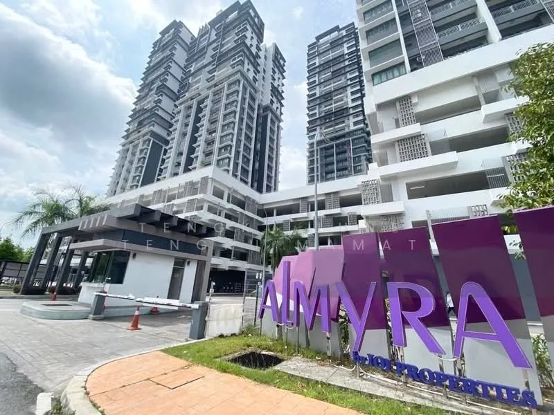 Exterior type: high-rise condominium; features: modern facade with glass and concrete, multiple storeys, landscaped entrance, security gate with access control, paved driveway, signage with the name 'ALMYRA', surrounded by greenery, parking area visible; style: modern.