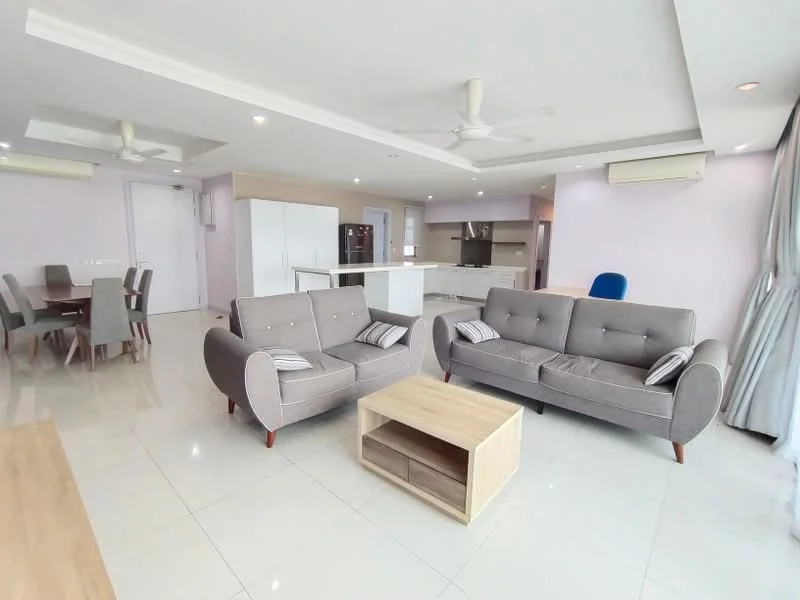 Living features: 2-seater fabric sofa in grey, 2-seater fabric sofa with striped cushions, wooden coffee table with storage, white ceiling with recessed lighting, 5-blade ceiling fan, large windows with sheer curtains, light-coloured tiled flooring, open layout to kitchen and dining area; style: modern. Dining features: 6-seater dining table, upholstered dining chairs, light-coloured wooden dining table, open layout to living area; style: modern. Kitchen features: white cabinetry, kitchen island, stainless-steel appliances, open layout to living area; style: modern.