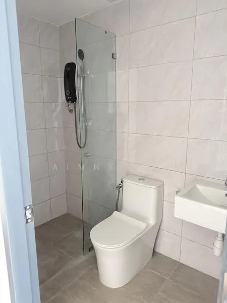 Bathroom features: glass shower enclosure, handheld shower, one-piece toilet, wall-mounted bidet spray, small wall-mounted sink, grey ceramic tile flooring, white tiled walls, chrome showerhead, chrome faucet; style: modern.
