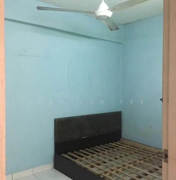 Bedroom features: light blue painted walls, ceiling fan, white tiled flooring, wooden bed frame without mattress, no visible closet or storage, single window, neutral decor, minimal furnishings.