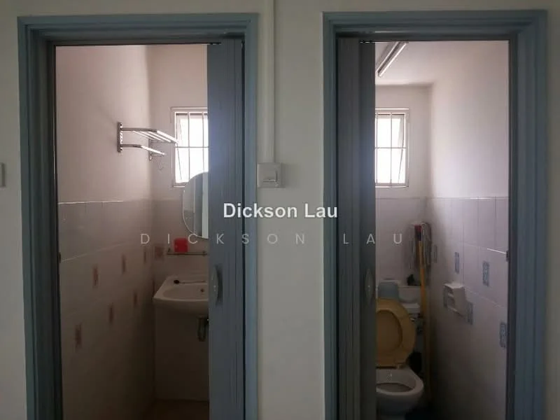 Room features: white painted walls, tile flooring, single-sink vanity with mirror, toilet, handheld shower, window with grid pattern, wall-mounted towel rack, light fixture on ceiling.