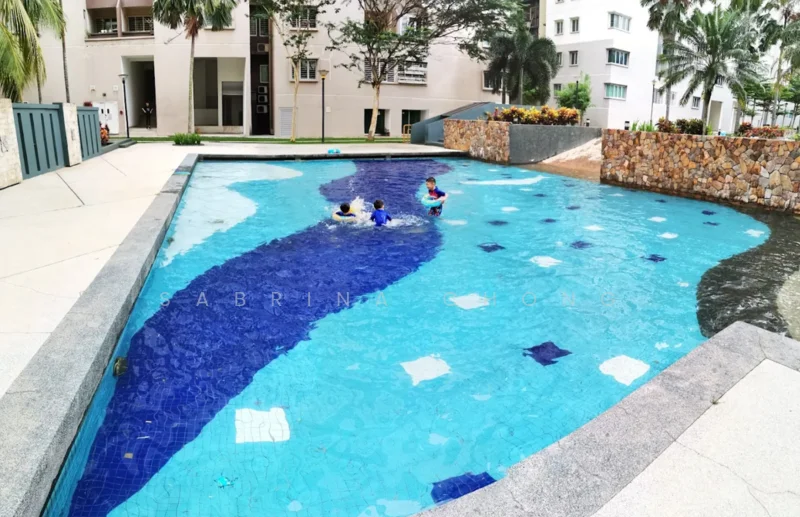 Exterior type: swimming pool deck; features: infinity pool, tiled pool surface with blue and white mosaic, surrounded by landscaped area, stone-clad feature wall, paved walkway, tropical landscaping with palm trees, children playing in the pool; style: modern.