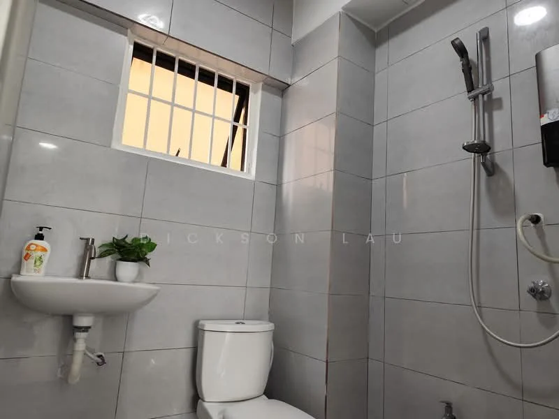Bathroom features: grey ceramic tile flooring, grey tiled walls, white toilet, wall-mounted sink, chrome shower head, handheld shower, wall-mounted shower mixer, window with security bars, small potted plant, soap dispenser; style: modern.