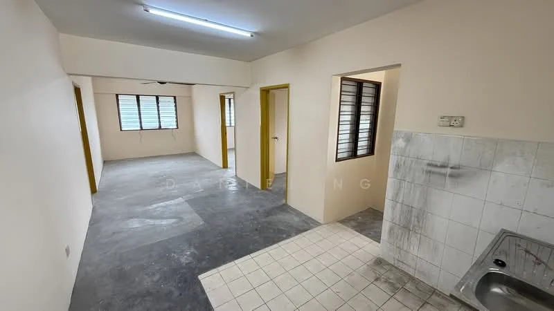 Room features: grey concrete flooring, white painted walls, two windows with horizontal slats, single-bowl stainless-steel sink, white tiled backsplash, light fixture on ceiling, doorways leading to other rooms.