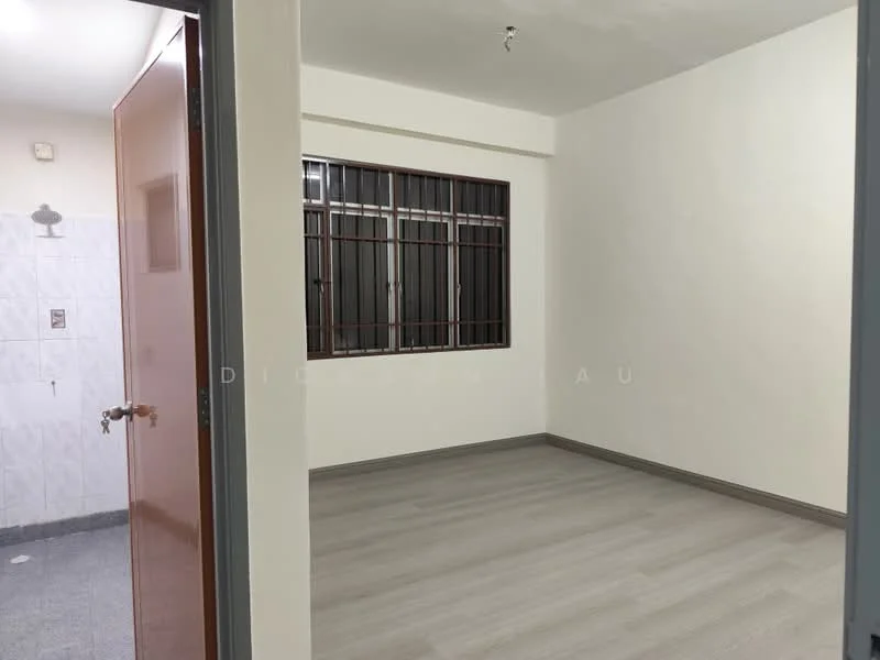 Room features: white painted walls, light grey laminate flooring, window with metal bars, ceiling light fixture, door leading to another room, corner wall with no visible features, neutral color scheme; style: modern.