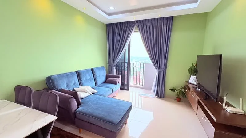 Living features: green painted walls, white ceiling with recessed lighting, 3-seater fabric sofa in blue, chaise lounge, area rug, wall-mounted TV, TV console, floor-to-ceiling windows, curtains, small indoor plant, round decorative rug; style: modern; view: city.