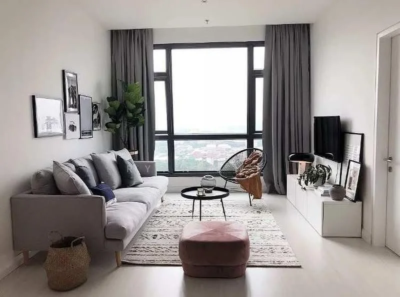 Living features: 3-seater fabric sofa in light grey, decorative cushions in various shades, round coffee table with black top, area rug with geometric pattern, potted houseplant, floor-to-ceiling windows, curtains in grey fabric, wall-mounted TV, white media console, decorative wall art, pink ottoman, woven basket; style: modern; view: city.