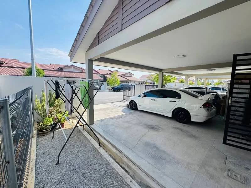 Exterior type: linked terrace house; features: car porch with awning, concrete flooring, manicured garden with plants, fenced perimeter, single-storey structure, gated entry, surrounded by residential houses, driveway with interlocking pavers; style: modern.