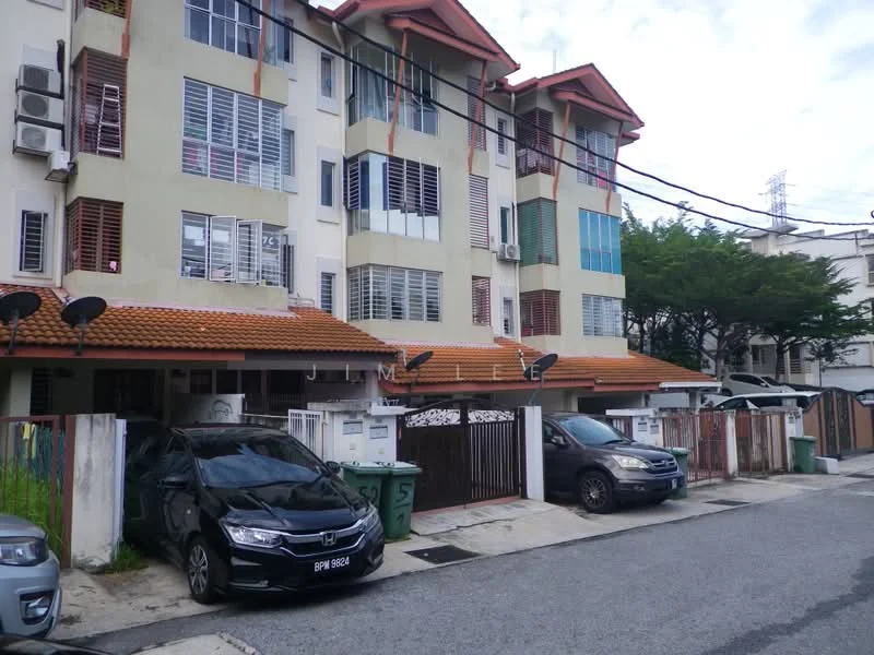 Exterior type: linked terrace house; features: two-storey building, red tiled roof, cream painted facade, multiple windows with grilles, car porch with awning, two visible parked cars, manicured landscaping, surrounded by greenery, security gate at entrance, visible air conditioning units; style: modern.