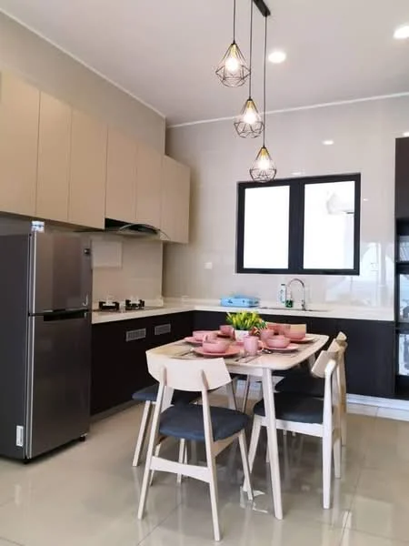 Kitchen features: light brown cabinetry, white countertop, stainless-steel fridge, built-in gas hob, extraction hood, double-bowl stainless-steel sink, chrome pull-down faucet, pendant lighting, grey dining chairs, white dining table, table settings with pink bowls, wall-mounted storage, glossy tile flooring, window with black frame; style: modern.