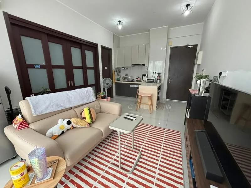 Living features: beige leather sofa, white throw blanket on sofa, decorative cushions, small side table, area rug with red and white stripes, wall-mounted TV, TV console, open shelving unit, kitchenette in background, grey tiled flooring, recessed ceiling lights, large window with sheer curtains, wall with wooden sliding doors; style: modern.