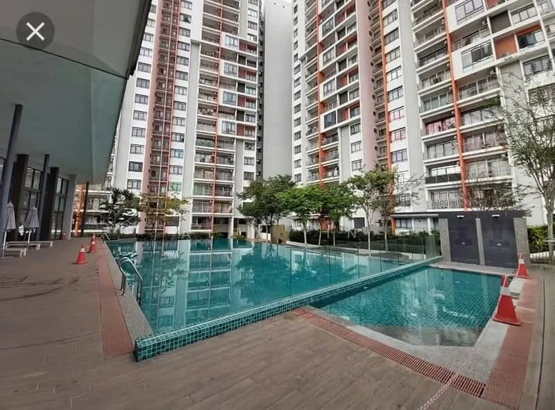Exterior type: high-rise condominium; features: infinity pool, pool deck with loungers, surrounded by greenery, tiled pool area, concrete walkway, landscaped garden, multiple storeys, glass facade, balconies visible on building; style: modern.