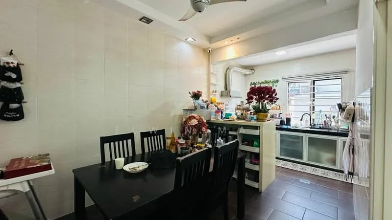Kitchen features: white tiled walls, dark ceramic tile flooring, ceiling with recessed lighting, 5-blade ceiling fan, kitchen cabinets with glass doors, stainless-steel sink, chrome pull-down faucet, countertop with space for appliances, window with view to outside, dining table with black chairs, decorative plants on countertop, kitchen appliances visible; style: modern.