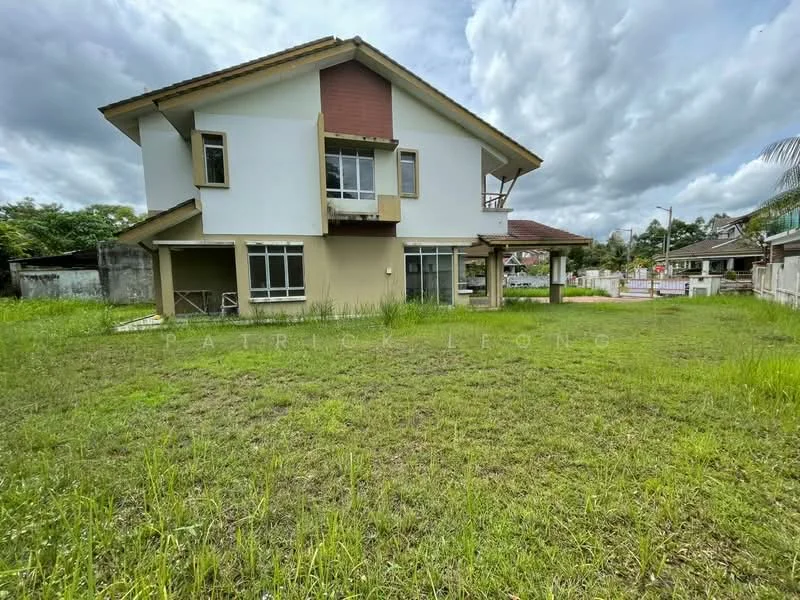 Exterior type: detached bungalow; features: two-storey building, white painted facade, brown accent on upper level, large windows, balcony on upper level, manicured lawn, surrounded by greenery, driveway, gated entry, open space around the house; style: modern.