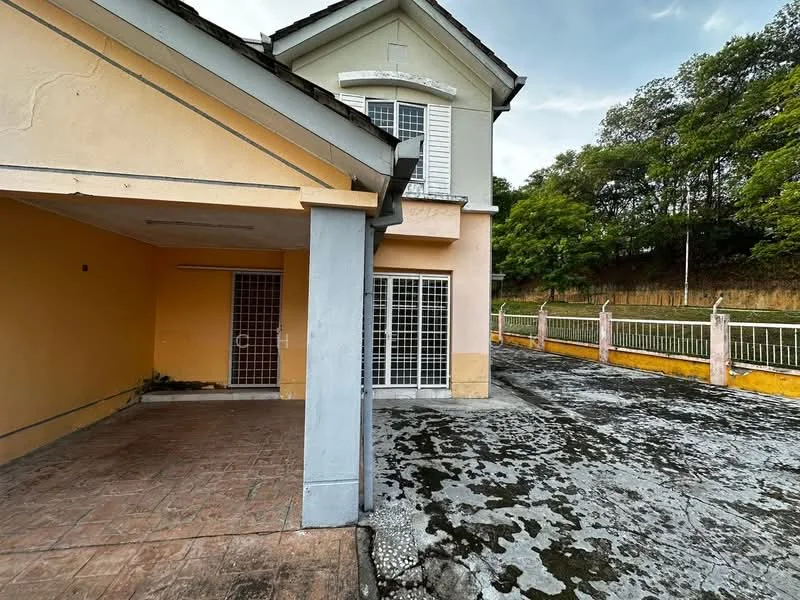 Exterior type: detached bungalow; features: yellow painted facade, white window frames, gated entrance, paved driveway, manicured lawn, surrounded by greenery, two-storey structure, sloping roof; style: modern.