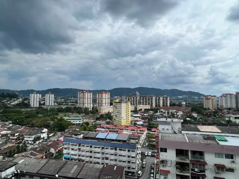 Exterior type: high-rise condominium; features: city skyline view, multiple high-rise buildings, varied building heights, green hills in background, cloudy sky, urban landscape, rooftops of low-rise buildings, residential areas, commercial buildings, parking lots; style: modern.