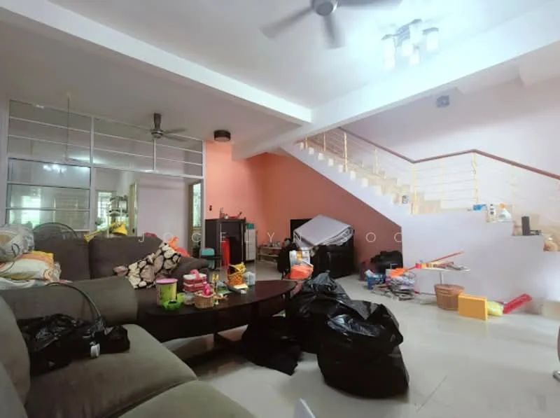 Living features: 3-seater fabric sofa in grey, coffee table, ceiling fan, recessed downlights, white walls, cream tiled flooring, staircase with railing, decorative items scattered, various bags and boxes, open layout, natural light from windows.