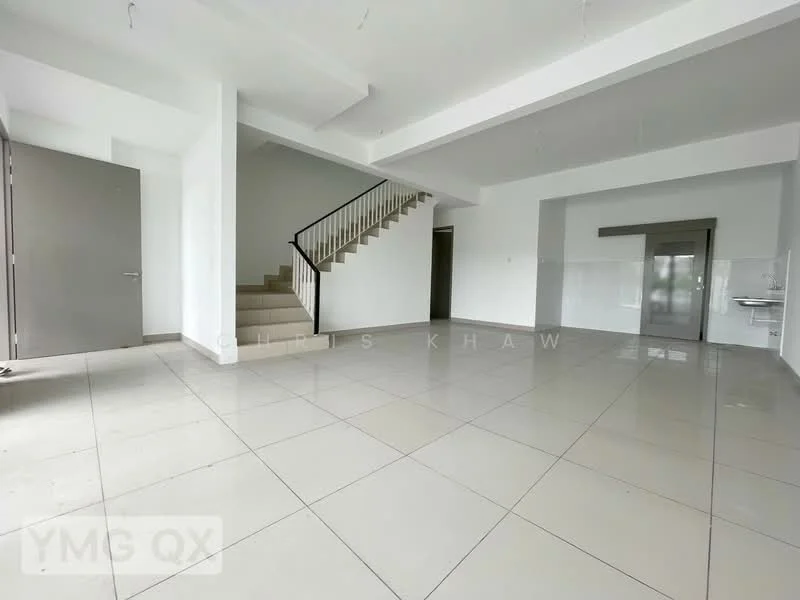 Room features: white painted walls, grey tiled flooring, staircase with wooden handrail, large windows allowing natural light, open layout, ceiling with exposed beams, no visible furniture, kitchenette area with sink, multiple light fixtures, high ceiling; style: modern.
