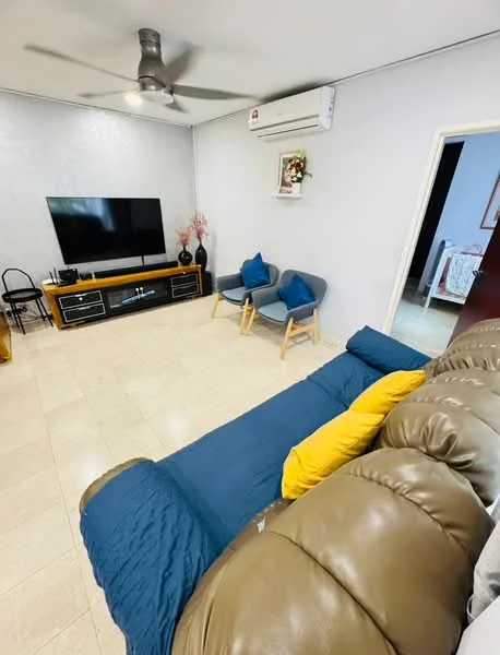Living features: 3-seater leather sofa in beige, blue throw blanket on sofa, yellow decorative pillow, 2 accent chairs with blue cushions, wooden TV console, wall-mounted flat-screen TV, air conditioning unit, cream tiled flooring, decorative wall art, light-colored walls, ceiling fan; style: modern.