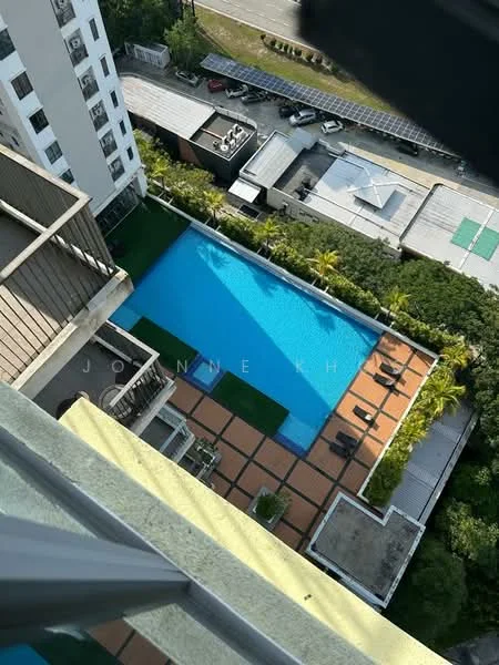 Exterior type: high-rise condominium; features: infinity pool, pool deck with loungers, manicured lawn, tropical landscaping, surrounded by greenery, solar panels on rooftop, parking lot visible, adjacent to main road; style: modern.