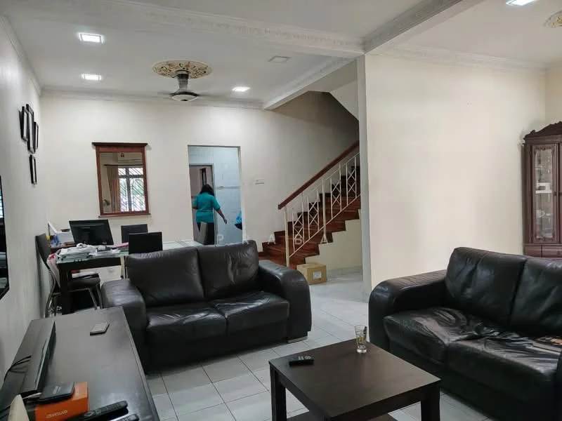 Living features: 2 black leather sofas, coffee table, wall-mounted TV, white painted walls, tile flooring, ceiling fan with light, decorative crown moulding, window with sheer curtains, open layout to staircase, computer desk with chair, staircase with wooden railing; style: modern. Room features: white painted walls, tile flooring, staircase with wooden railing.