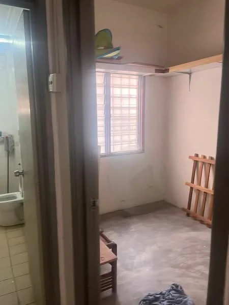 Room features: bare concrete flooring, white painted walls, window with grid pattern, shelving unit, wooden rack, doorway, no visible furniture, minimal decor; style: minimalist.