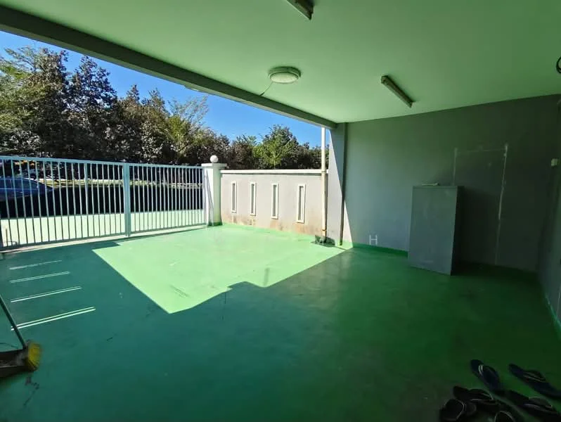 Exterior features: green painted flooring, grey painted walls, metal gate, outdoor space, overhead lighting, open area, surrounded by greenery.