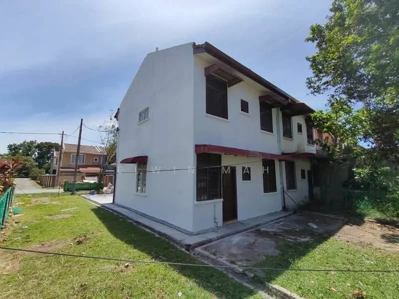 Exterior type: semi-detached house; features: white painted facade, flat roof, two-storey, manicured lawn, concrete pathway, window grilles, awnings over windows, surrounded by greenery; style: modern.