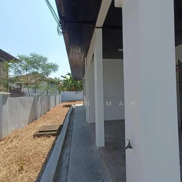 Exterior features: white painted walls, concrete flooring, flat roof, landscaped area with soil, surrounding greenery, fence, pathway; style: modern.