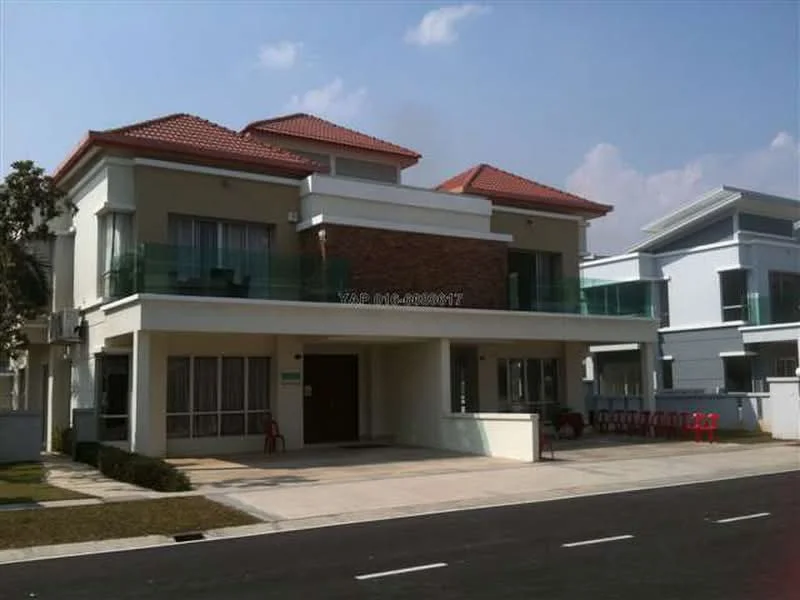 Exterior type: semi-detached house; features: two-storey structure, red tiled roof, cream painted facade, exposed brick feature wall, glass balcony railings, large windows, manicured lawn, paved driveway, surrounded by other residential buildings, clear sky, street view; style: modern.