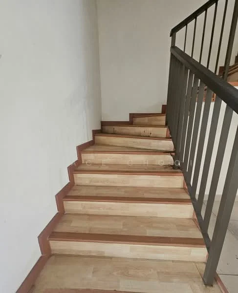 Room features: wooden staircase, light wood treads, dark wood risers, metal railing, plain white walls; style: modern.