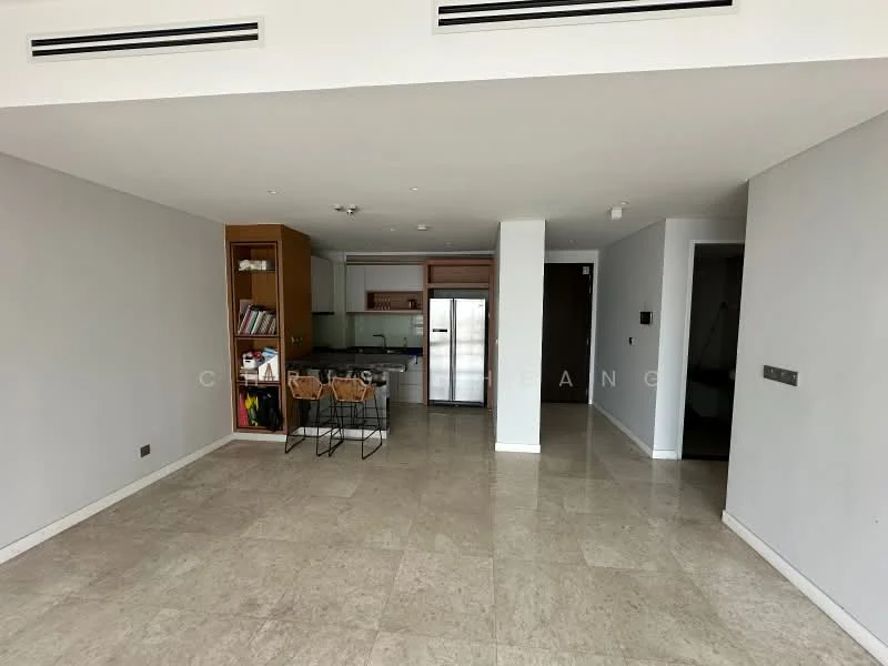 Living features: cream marble tile flooring, white painted walls, recessed downlights, open-plan layout, kitchen island with bar stools, built-in cabinetry, stainless-steel fridge, sliding door to balcony, large windows for natural light; style: modern.