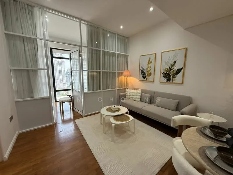 Living features: grey fabric sofa, round coffee table, area rug with geometric pattern, floor-to-ceiling windows, curtains, wall-mounted artwork, wooden flooring, table with dining settings; style: modern; view: city. Room features: glass partition, natural light from windows.