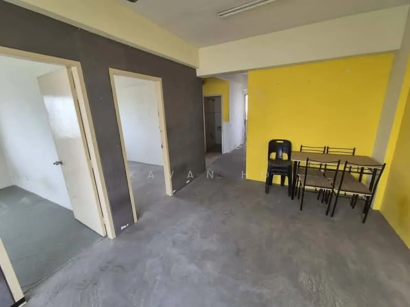 Room features: grey accent wall, yellow painted wall, plain white walls, concrete flooring, dining table with four chairs, two doors visible, open layout, fluorescent ceiling lights; style: minimalist.
