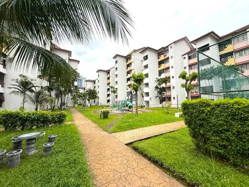 Exterior type: low-rise apartment block; features: manicured lawn, paved walkway, playground equipment, palm trees, landscaped garden, basketball court, multi-storey building, balconies on upper floors, green hedges, surrounding greenery; style: modern.