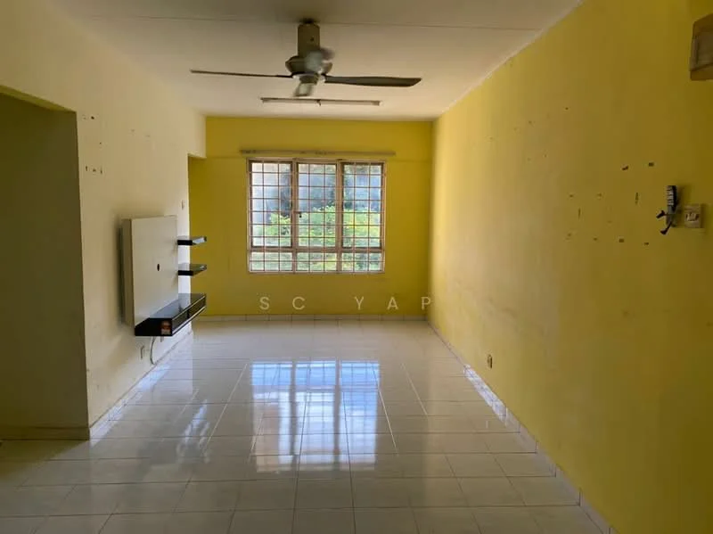 Living features: yellow painted walls, white tiled flooring, 5-blade ceiling fan, large windows with grid pattern, wall-mounted TV console, natural light from windows, no visible furniture, clean and empty space; view: garden.