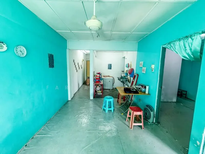 Room features: turquoise painted walls, concrete flooring, ceiling fan, wall clock, dining table, plastic stools, open layout, light fixtures, doorway leading to another room; style: minimalist.