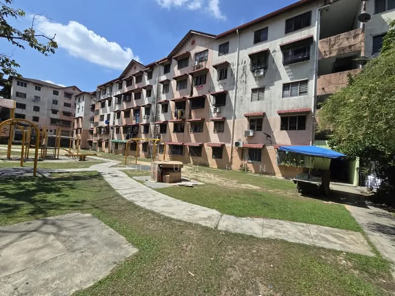Exterior type: low-rise apartment block; features: 3-storey building, exposed concrete facade, balconies with metal railings, playground area, manicured lawn, concrete pathway, air conditioning units visible, surrounding greenery; style: traditional.