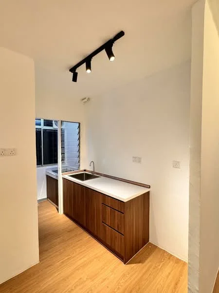 Kitchen features: wood cabinetry, white countertop, single-bowl stainless-steel sink, chrome pull-down faucet, track lighting, laminate flooring, white painted walls, window with view to outside; style: modern.