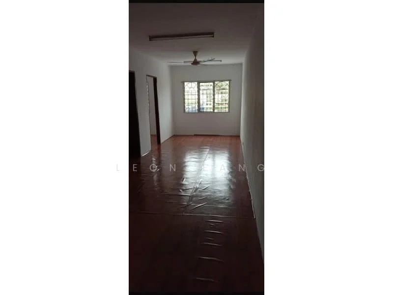 Room features: white painted walls, wooden flooring, ceiling fan, window with grid design, natural light from window, plain ceiling, no visible furniture.