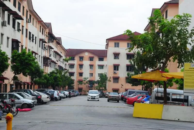 Exterior type: low-rise apartment block; features: 2-storey building, red tiled roof, balconies with metal railings, manicured landscaping, parking lot with multiple vehicles, surrounding trees, yellow awning, paved driveway; style: modern.