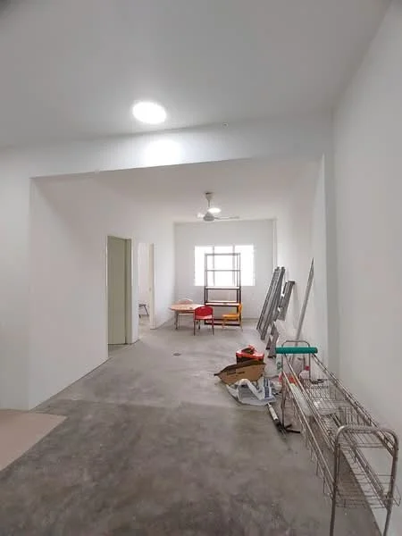 Room features: white painted walls, concrete flooring, ceiling light, ceiling fan, window with grille, table with chairs, metal shelving unit, boxes and miscellaneous items; style: minimalist.