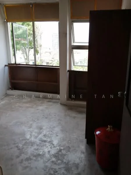 Room features: concrete flooring, large windows with yellow roller blinds, wooden window frames, wooden railing, wooden cabinet, red storage container, exposed walls, natural light from windows; style: minimalist; view: garden.