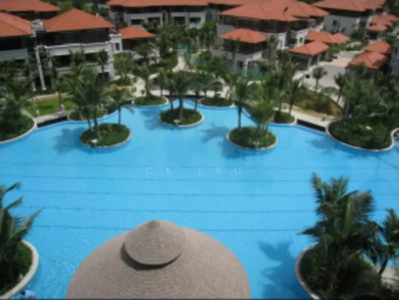 Exterior type: landscape garden; features: large swimming pool, island landscaping with palm trees, thatched gazebo, surrounding residential buildings with red tiled roofs, manicured lawns, tropical landscaping; style: tropical-modern.