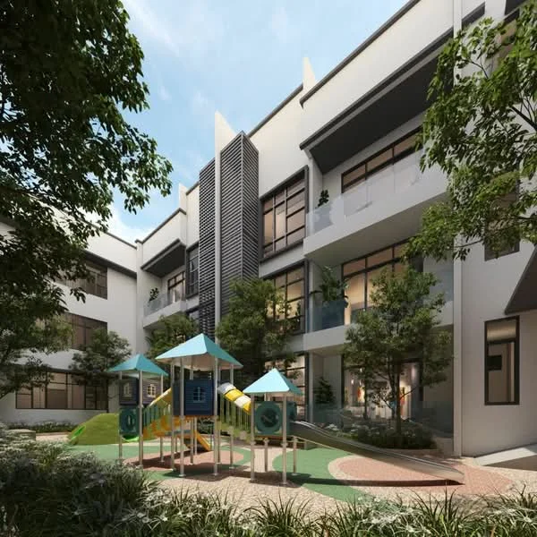 Exterior type: low-rise apartment block; features: playground with slides and climbing structures, landscaped garden area, manicured lawn, mature trees, paved walkway, balconies with glass railings, modern facade with vertical fins, large windows, outdoor seating area; style: modern.