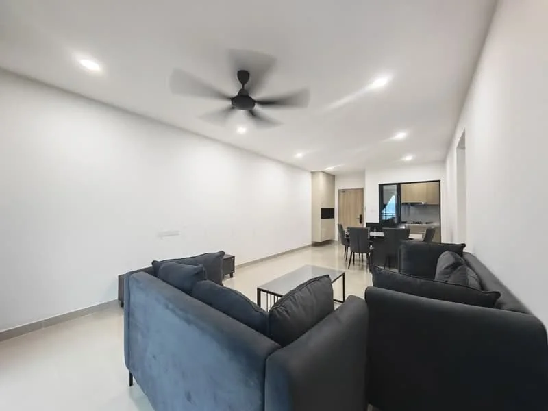 Living features: 5-blade ceiling fan with light, grey fabric sectional sofa, 2-seater grey fabric sofa, coffee table, wall-mounted TV, recessed LED downlights, white painted walls, light-colored tile flooring, open layout to kitchen, large windows for natural light; style: modern.