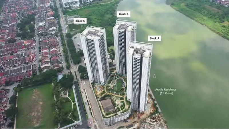Exterior type: high-rise condominium; features: three tall residential towers, waterfront view, landscaped garden area, surrounding residential neighborhood, parking area visible, green space adjacent to the buildings; style: modern.