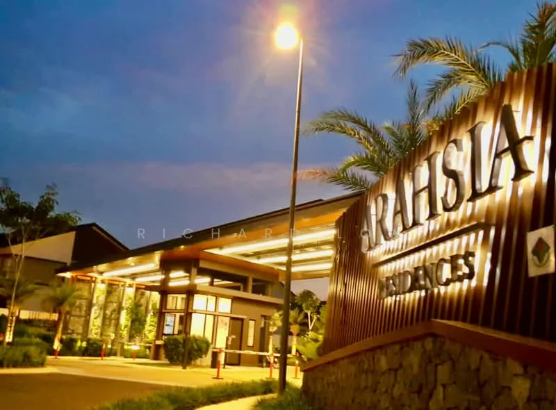 Exterior type: low-rise apartment block; features: wooden facade, stone cladding, landscaped garden with palm trees, outdoor lighting, manicured lawn, covered entrance, signage with illuminated letters, modern architectural design; style: modern.