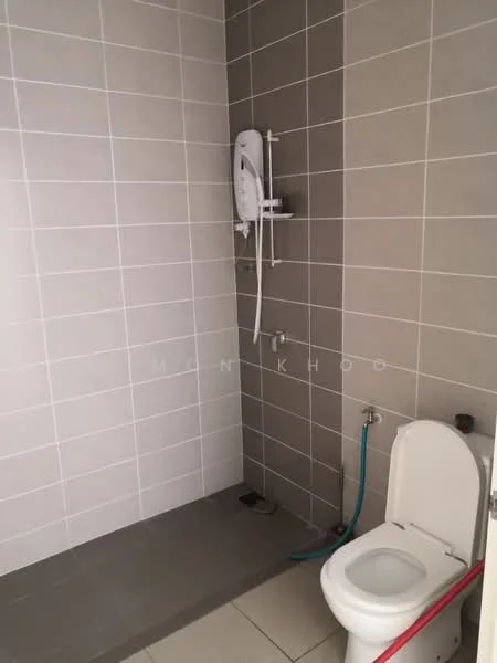 Bathroom features: white toilet, shower area with wall-mounted shower head, grey tiled walls, light grey floor tiles, drain in floor, water supply pipe visible; style: modern.